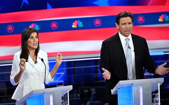 Former Governor of South Carolina and United Nations ambassador Nikki Haley (left) and Florida Governor Ron DeSantis speak during the third Republican presidential primary debate at the Knight Concert Hall at the Adrienne Arsht Center for the Performing Arts in Miami, Florida, on Nov. 8, 2023. (Mandel Ngan/AFP via Getty Images/TNS)