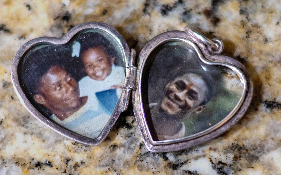 A locket contains photos of Keshia Jeffries-Cobb and her father, a Navy sailor who died in a vehicle accident. 