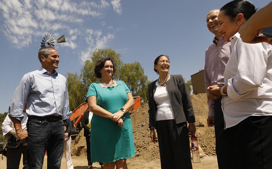 From left, California Secretary of Natural Resources Wade Crowfoot, Rep. Congresswoman Katie Porter, U.S. Secretary of the Interior Deb Haaland, U.S. Bureau of Reclamation Commissioner Camille Calimlim Touton and Paul Cook, general manager of the Irvine Ranch Water District, speak at the Rattlesnake Recycled Water Pump Station on Thursday, Aug. 18, 2022. 