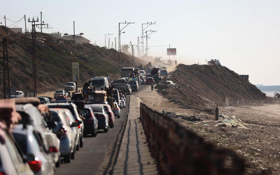 Displaced Palestinian families from the northern and central Gaza Strip evacuate toward southern Gaza on Friday, Oct. 13, 2023.