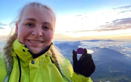 Jasmine Swainson, author of "Hannah's Creative Cooking," carries a purple rock in remembrance of Hannah Wachsman while climbing Mount Fuji in this undated photo.