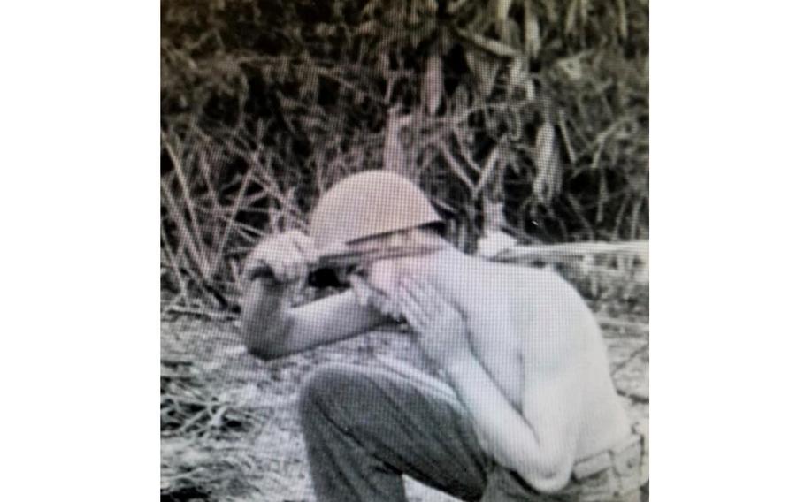Robert Passanisi shaves with a bayonet while serving with Merrill’s Marauders in Burma during World War II in this undated photo. Lawmakers on Wednesday, May 25, 2022, awarded the Congressional Gold Medal to the Marauders, bestowing the nation’s highest civilian honor to the famed Army unit.
