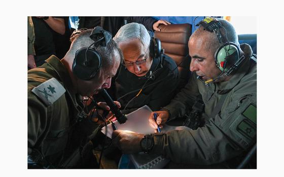 Isareli Prime Minister Benjamin Netanyahu gets a briefing from Israel Defense Forces personnel as seen in a post on Thursday, May 16, 2024.