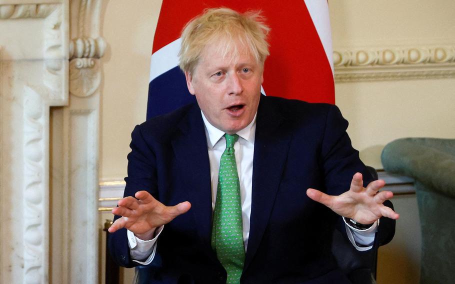 Britain’s Prime Minister Boris Johnson gestures ahead of a meeting inside 10 Downing Street in central London on July 1, 2022. 