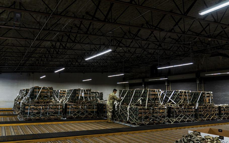 Pallets of ammunition, weapons and other equipment bound for Ukraine sit at a storage bunker at Dover Air Force Base.