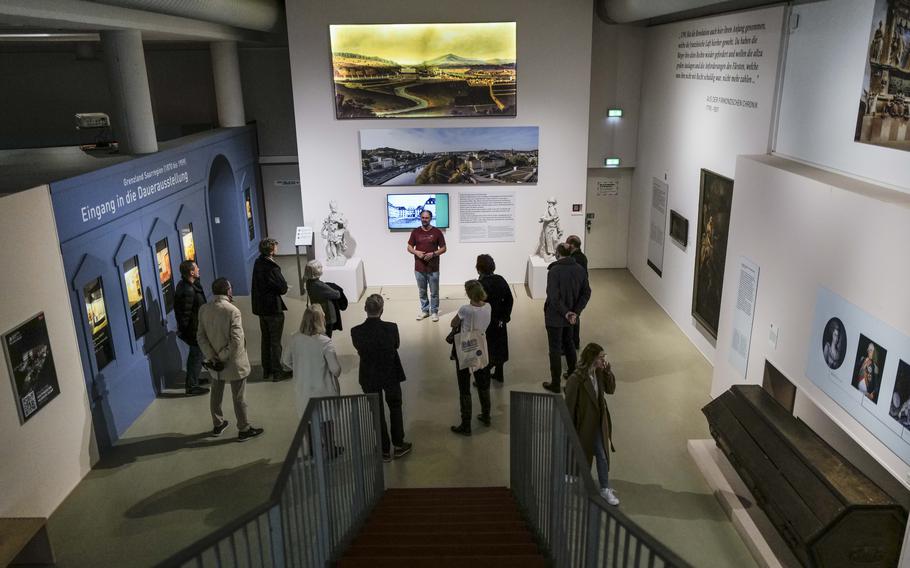 A tour group delves into the history of Saarbruecken Castle at the Saar Historical Museum in Saarbruecken, Germany, on Oct. 19, 2023. 