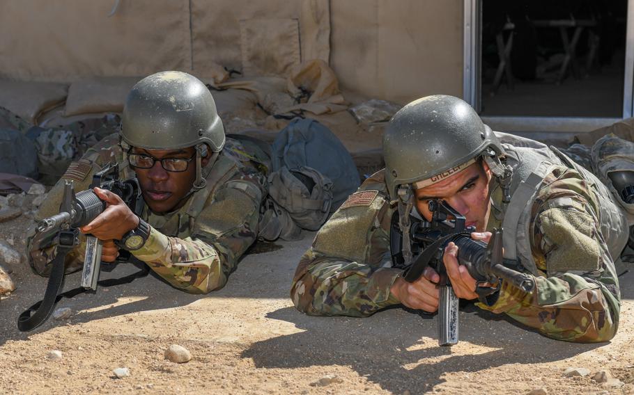 U.S. Air Force trainees guard a tent during a scenario in Texas on Oct. 26, 2022. PACER FORGE is the new field training component for Air Force recruits during basic training. It replaced the program known by the acronym BEAST.