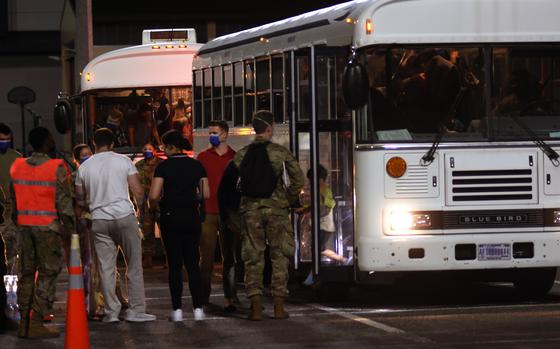 A little boy steps off the bus at Ramstein Air Base, Germany, on Friday, Aug. 20, 2021, after arriving on a U.S. military flight from Al Udeid Air Base, Qatar. The boy was one of hundreds of evacuees from Afghanistan who were to spend the night Friday at Ramstein, which is prepared to temporarily support up to 5,000 people as they move to the United States and elsewhere after fleeing the Taliban.

