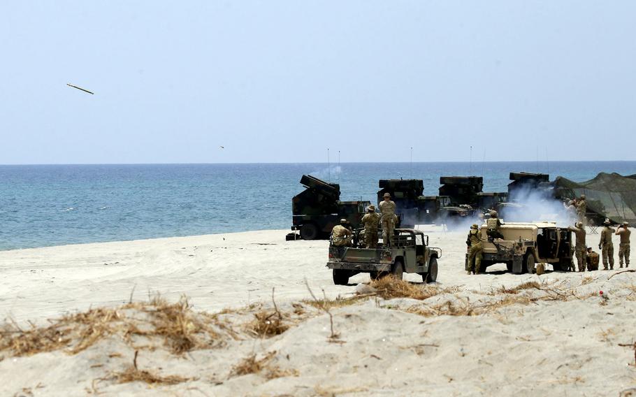 A Stinger missile is fired from an Avenger Air Defense System mounted on a Humvee during a Balikatan drill at Naval Station Leovigildo Gantioqui in San Antonio, Philippines, Tuesday, April 25, 2023.