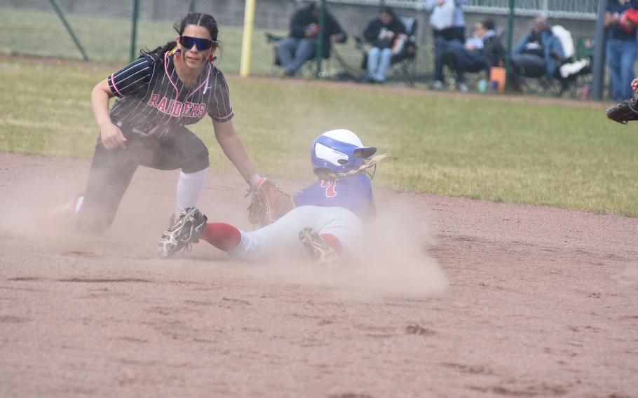 Ramstein's Emma Inthavixay slide safely into second before Kaiserslautern's Alessia Garcia can make the tag Friday, May 22, 2025, at the DODEA-Europe Division I softball championships at Kaiserslautern, Germany.