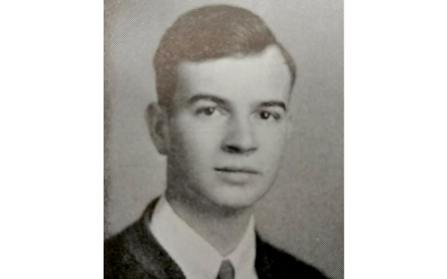 McKee wearing a coat and tie