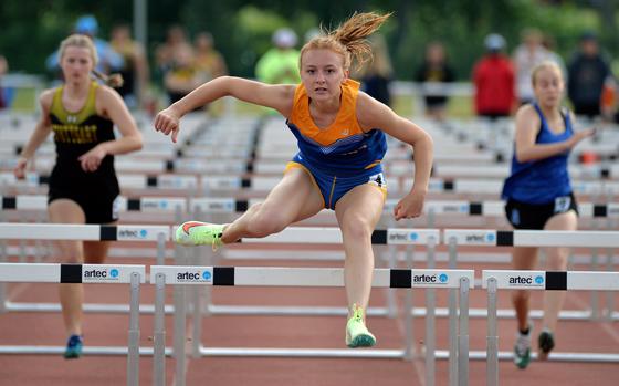 Wiesbaden’s Eva Stout clears the final hurdle on her way to winning the girls 100-meter hurdle event at the DODEA-Europe track and field championships in Kaiserslautern, Germany, in 15.3 seconds.