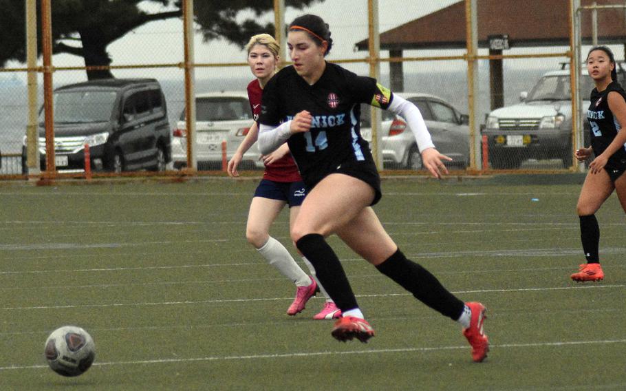 Giovanna Kennedy moves the ball up the field.