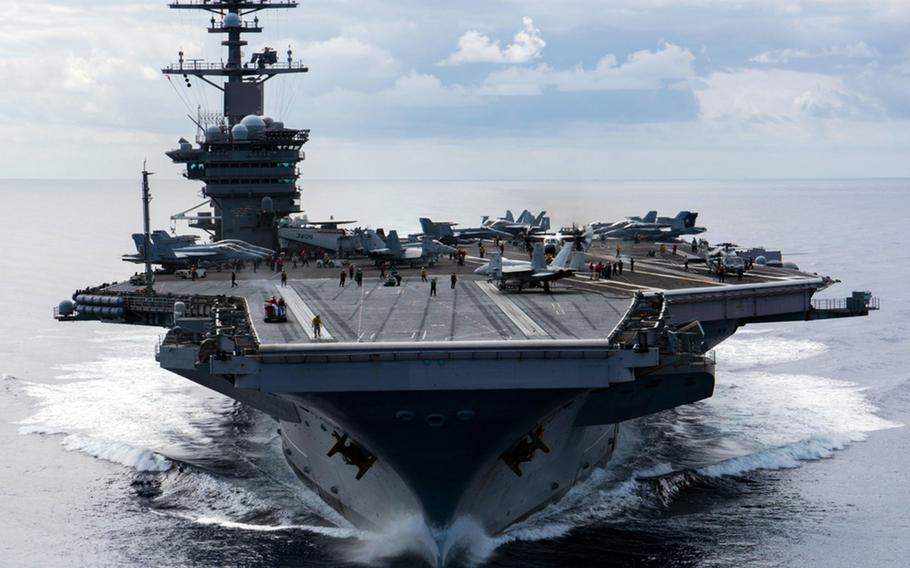 The aircraft carrier USS Carl Vinson, shown here somewhere in the Pacific Ocean in 2018, is slated to visit Yokosuka Naval Base in Japan for the first time in nearly two decades. 