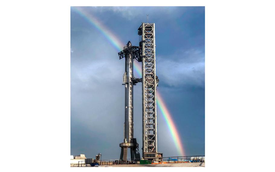 A rainbow forms the backdrop of the Starship rocket system on April 10, 2023.