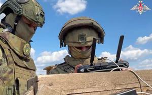 In this photo taken from video distributed by the Russian Defense Ministry Press Service on Monday, May 26, 2025, Russian serviceman train to operate military drones in an undisclosed location. (Russian Defense Ministry Press Service via AP)