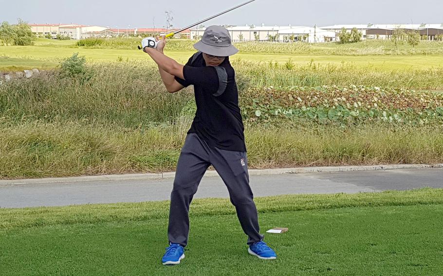 Humphreys Gold's Trevor Yi drives the fairway during Thursday's DODEA-Korea season-opening golf match. Yi and Gold edged Humphreys Black 4-3.