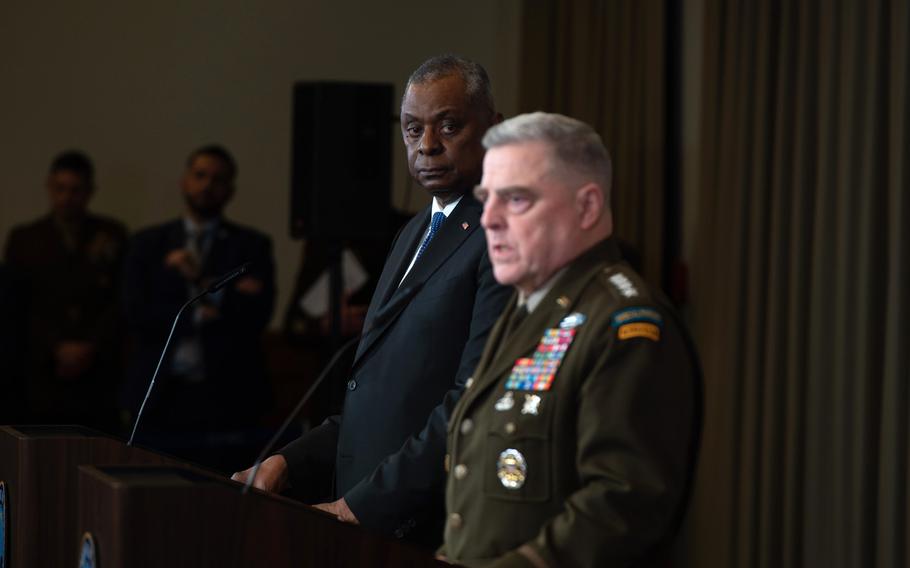 U.S. Defense Secretary Lloyd Austin listens as Army Gen. Mark Milley, chairman of the Joint Chiefs of Staff, speaks to reporters following the Ukraine Contact Group meeting at Ramstein Air Base, Germany, on Friday, Jan. 20, 2023.