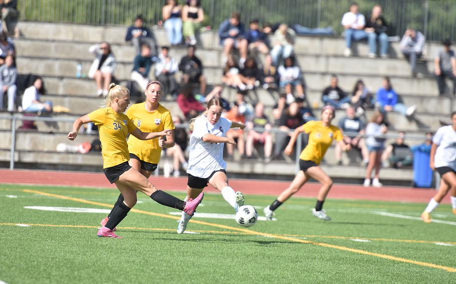 Kaiserslautern's MaiLinh Guckeyson tries to get a foot in front of Stuttgart's Brielle Aplanalp before she can kick it Tuesday, May 20, 2025 at the DODEA-Europe Division I girls soccer championships at Ramstein Air Base, Germany.