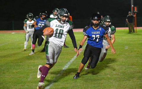 AFNORTH receiver and running back Nathen Goldsmith blows past defenders for a touchdown in the first half of a football game against the Hohenfels Tigers on Sept. 29, 2023 at Hohenfels Middle High School. Goldsmith finished the night with two rushing and one receiving touchdowns. 