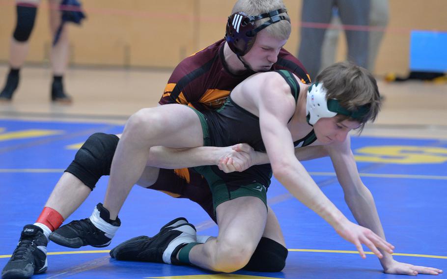 In a 113-pound match, Vilseck’s Christopher Wissemann, left, has AFNORTH’s Caden Cook in his grip on his way to a win at the DODEA-Europe wrestling finals in Wiesbaden, Germany, Feb. 10, 2023.