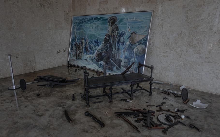 Masanori Uragami's 1971 painting, "The Bandeirantes yesterday and today," lies defaced in Brazil's Supreme Court building after supporters of former president Jair Bolsonaro stormed the capital on Jan. 8. 