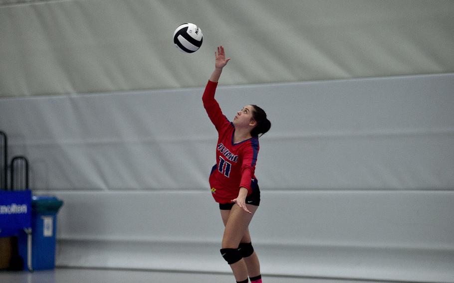 Aviano's Abigail Desporte serves during the Saints' match with Black Forest Academy during pool-play action of the DODEA European volleyball championships on Oct. 26, 2023, at Ramstein High School on Ramstein Air Base, Germany.