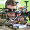 Army Sgt. Nicholas Murphy, of the 3rd Infantry Division’s Combat Aviation Brigade, tinkers with a hexacopter drone he built on July 26, 2024 just before a test flight at a Hinesville, Ga., airfield just outside Fort Stewart. Murphy participated in a first-of-its-kind drone building class run by the division’s Marne Innovation Center at Fort Stewart. (Corey Dickstein/Stars and Stripes)