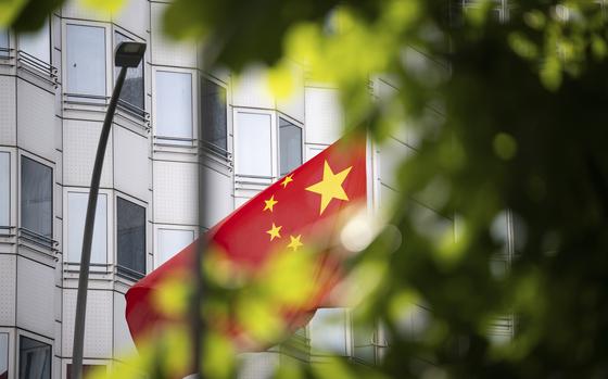 A country's flag flies in front of the embassy of China in Berlin, Germany, Monday, April 22, 2024. Three people suspected of spying for China and facilitating the transfer of information on technology with potential military uses were arrested in Germany on Monday. The homes and offices of the suspects, who were arrested in Duesseldorf and in Bad Homburg, near Frankfurt, were searched. (Hannes P. Albert/dpa via AP)