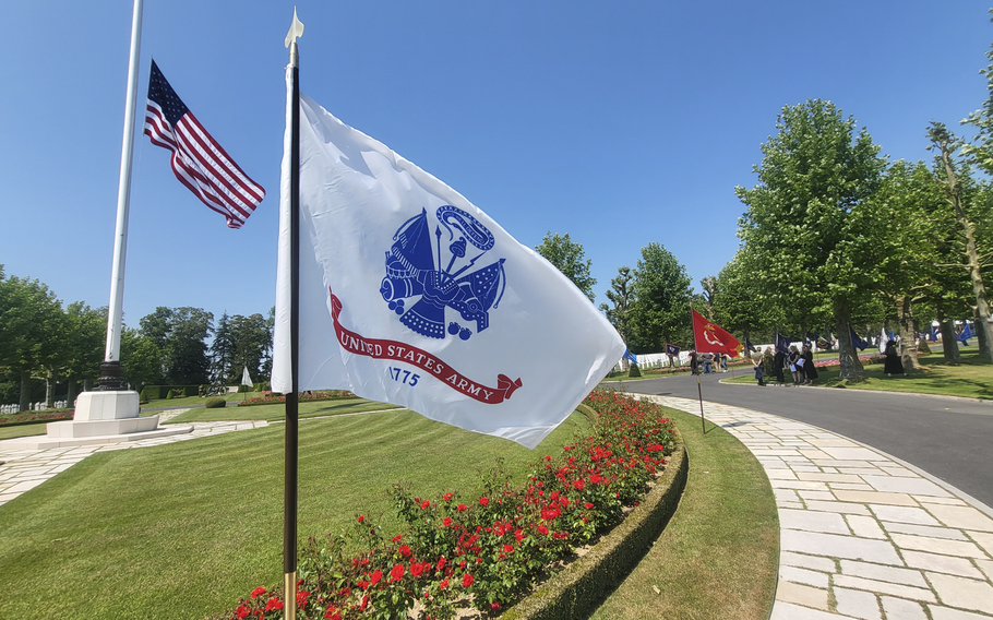 The flags of the United States and the U.S. Army fly at Oise-Aisne American Cemetery in Seringes-et-Nesles, France, on Wednesday, June 7, 2023.