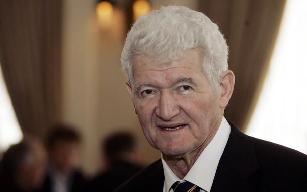 Mathematician Peter Lax wearing a black suit.