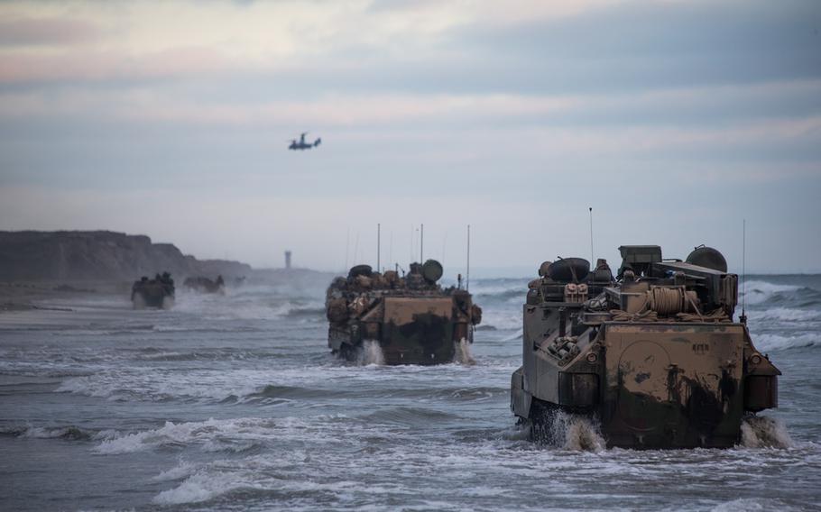 U.S. Marines with Bravo Company, Battalion Landing Team 1/4, 15th Marine Expeditionary Unit, drive AAV-P7/A1 assault amphibious vehicles through the surf during sustainment training at Marine Corps Base Camp Pendleton, Calif., July 14, 2020. 