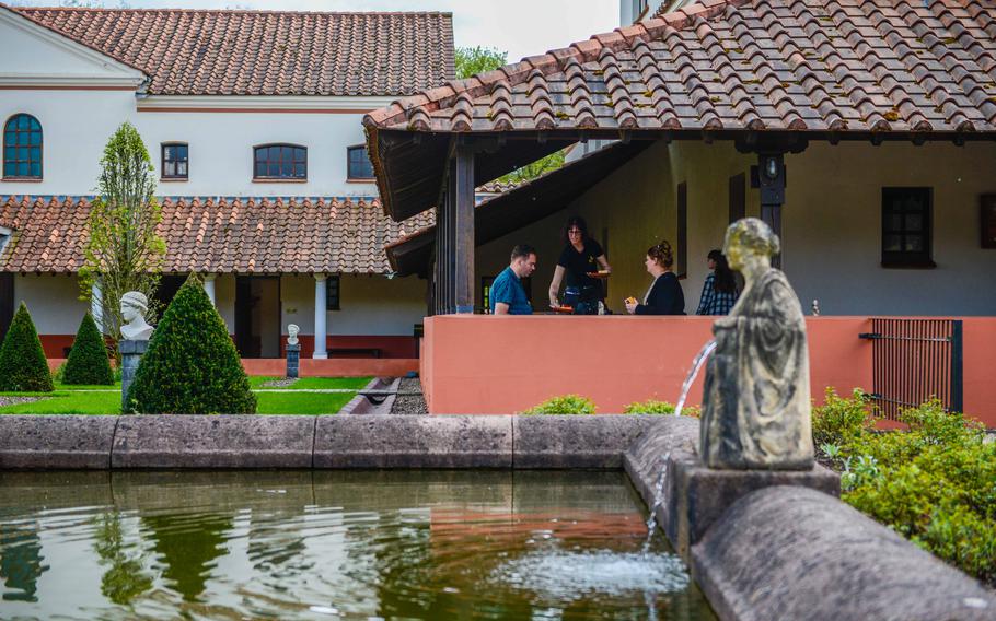 Guests dine at the Villa Borg Tavern on the grounds of the restored Roman villa in Borg, Germany, May 2, 2023. The tavern serves a variety of Roman-style dishes and modern Italian and local favorites, such as pasta and Lucanian sausages.