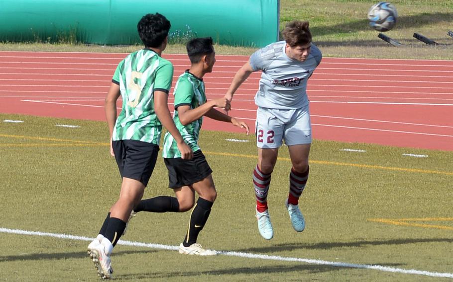 Noah Charles heads the ball.