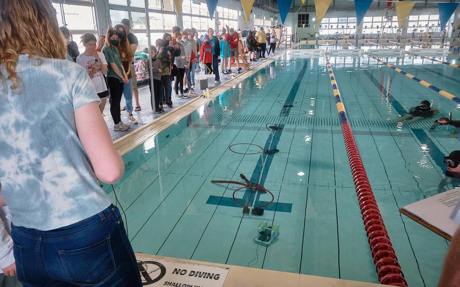 A student guides a remotely operated vehicle through an underwater obstacle course during the SeaPerch Challenge at Yokosuka Naval Base, Japan, Sunday, March 20, 2022.