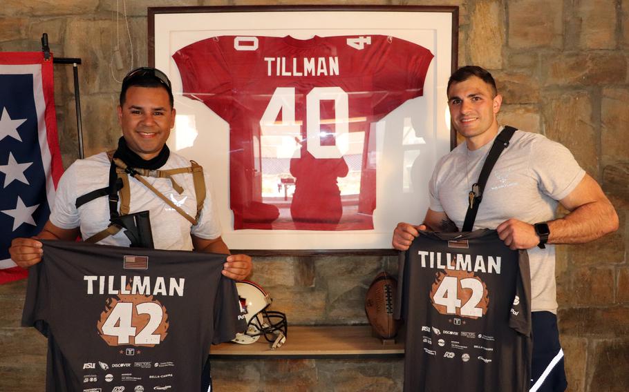 Airmen pose with the jersey of Pat Tillman, a former NFL player who joined the Army Rangers, after a memorial run April 23, 2021 at Bagram Airfield, Afghanistan.