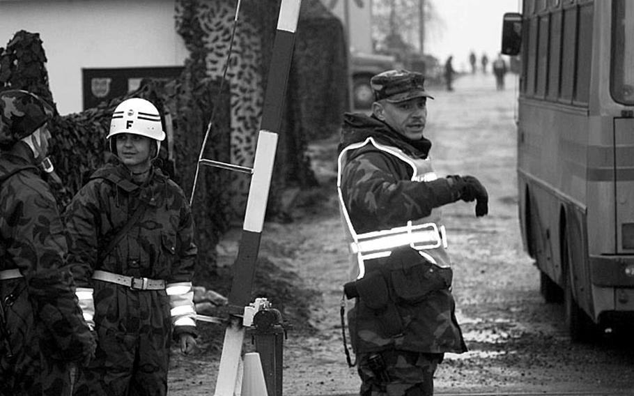 Taszar AB, Hungary, January, 1996: A soldier directs traffic at Taszar AB.