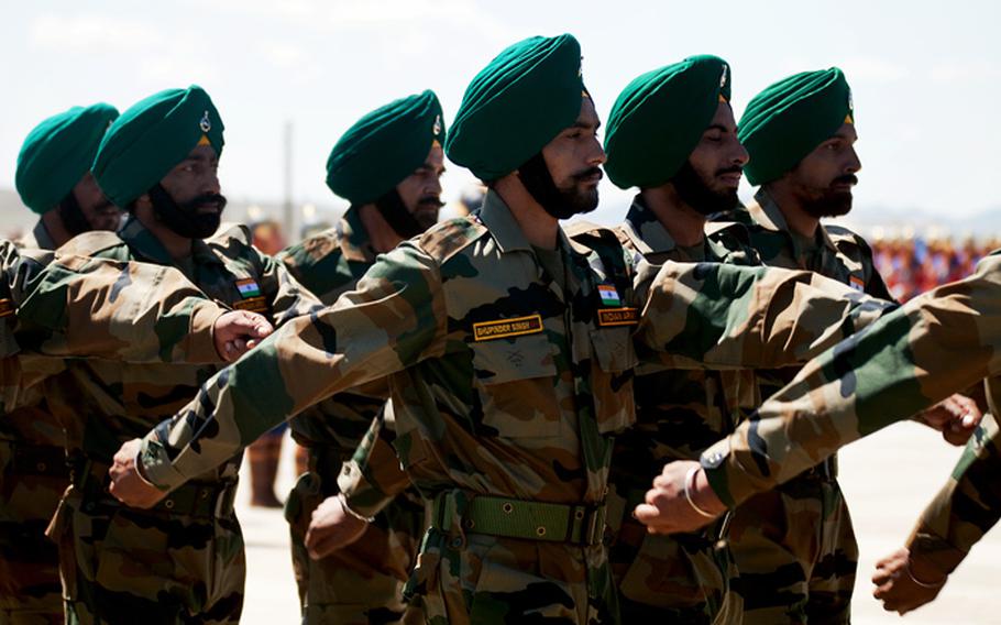 A platoon from 2nd Battalion, Sikh Regiment, Indian army, marches during a pass and review for delegates at the opening ceremony of Exercise Khaan Quest 2011 at Five Hills Training Area, Ulaanbaatar, Mongolia, July 31.