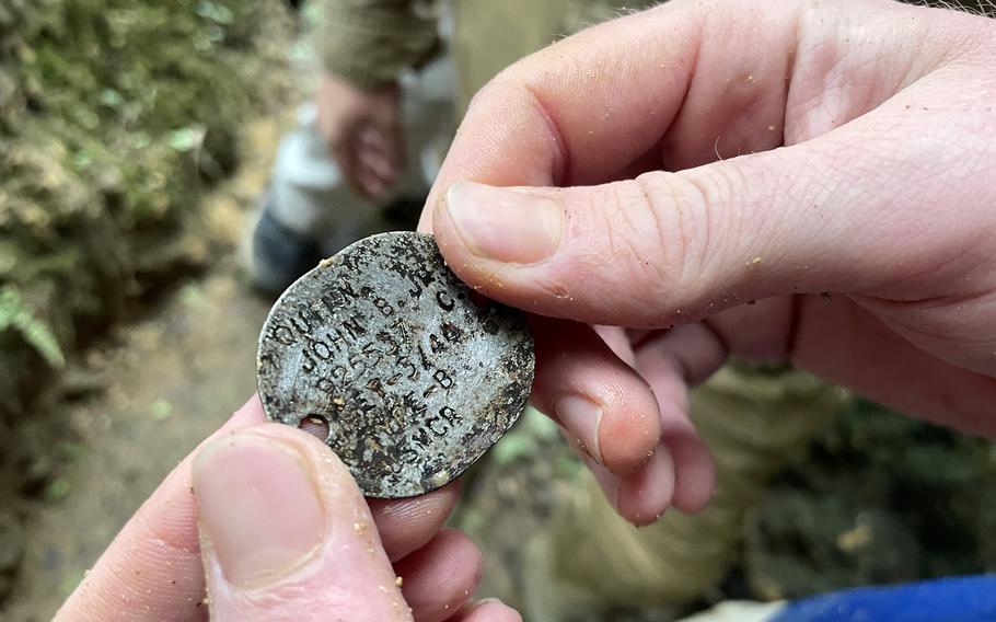 This dog tag belonging to Marine Pfc. John Quinn Jr., was found inside an Okinawa cave along with human remains and other items, Sept. 6, 2022. 