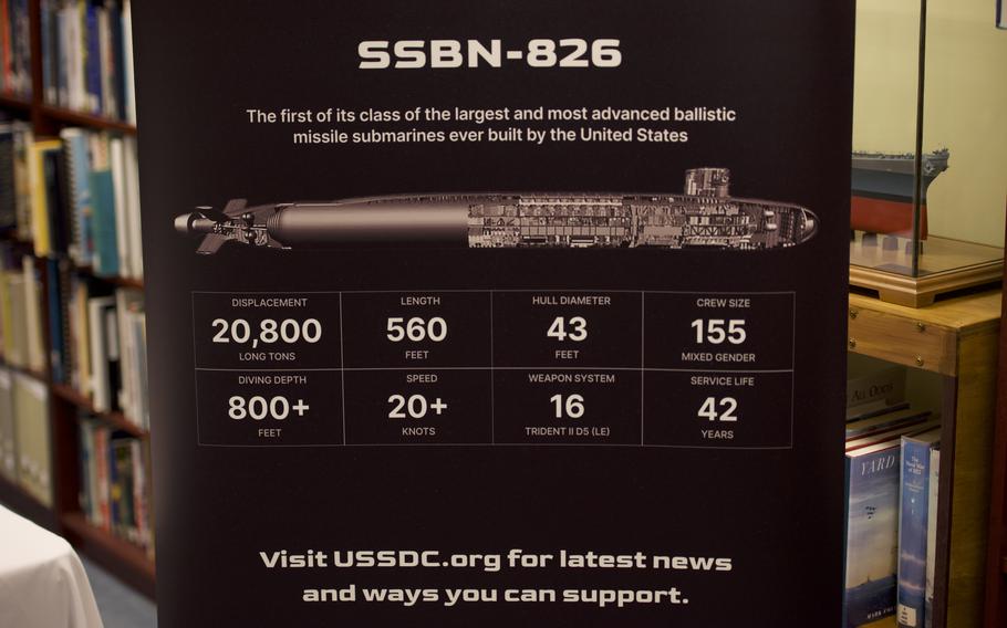 A poster with an illustration of a submarine and a table with some facts about the submarine.