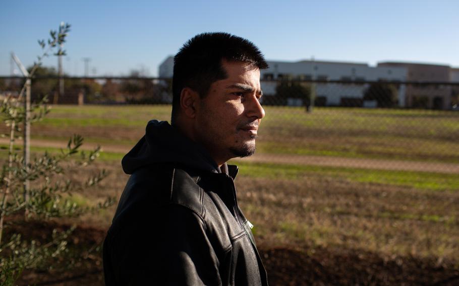 Emal Salarzai stands outside his his e-commerce business in Sacramento as he works to find a way out of Afghanistan for his parents who are on the run from the Taliban on Thursday, Nov. 11, 2021 in Sacramento, Calif.