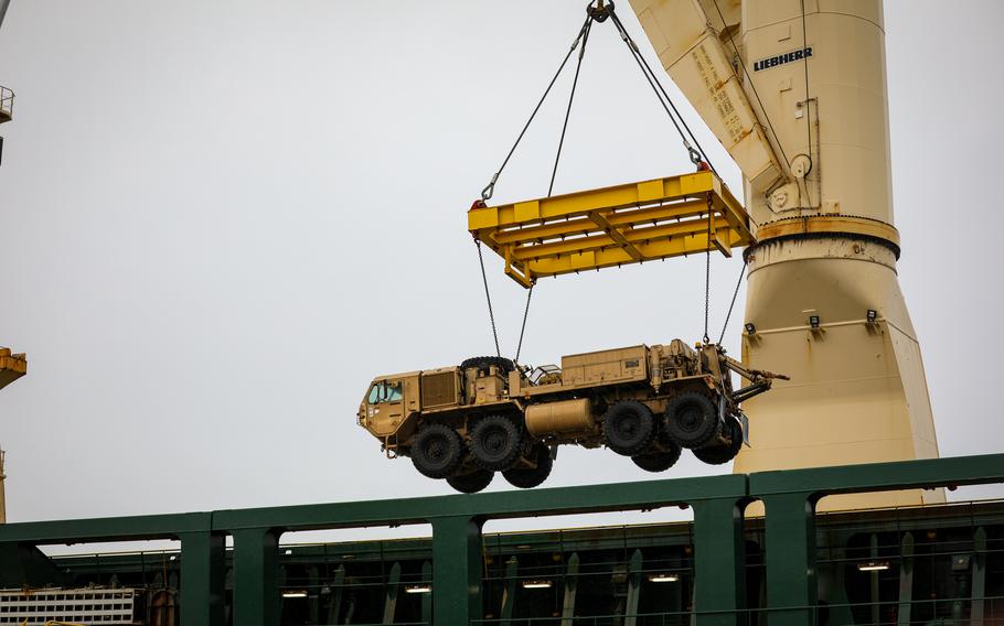 An M984A4 heavy expanded mobility tactical truck, or HEMTT, is loaded onto the Ocean Grand by crane Dec. 7, 2023, in Setubal, Portugal. U.S. Army equipment that had been used in Estonia was sent back stateside via Setubal.