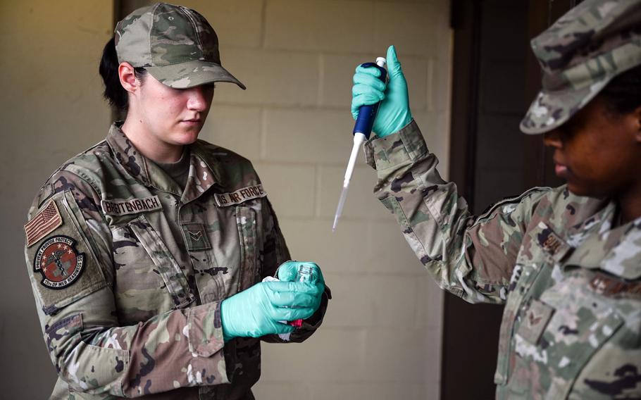 Airmen with the 15th Operational Medical Readiness Squadron test water from a dining facility at Joint Base Pearl Harbor-Hickam, Hawaii, Friday, Dec. 10, 2021.