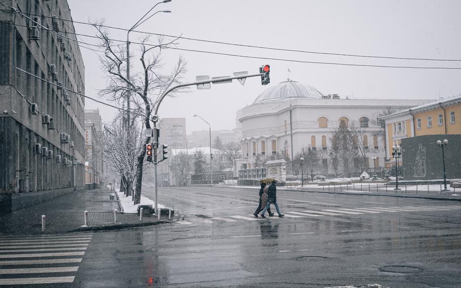 In March, wood still covers a Kyiv cultural center's windows that were shattered by the Russian airstrike on Oct. 10. 