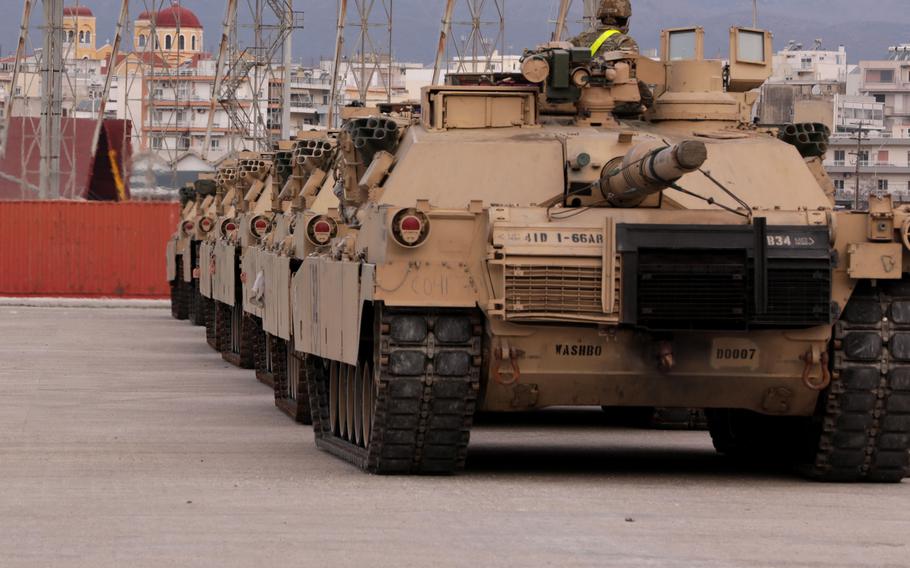 Soldiers with 3rd Armored Brigade Combat Team, 4th Infantry Division, stage M1 Abrams main battle tanks at a port in Alexandroupoli, Greece, March 21, 2022. The U.S. and NATO are reinforcing their presence in Eastern Europe following the Russian invasion of Ukraine. NATO heads of state, including President Joe Biden, are to meet in Brussels Thursday for emergency talks.