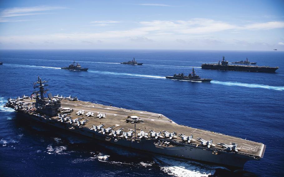 The USS Nimitz and USS Ronald Reagan strike groups steam alongside Japanese and French warships in the Philippine Sea, June 9, 2023. 