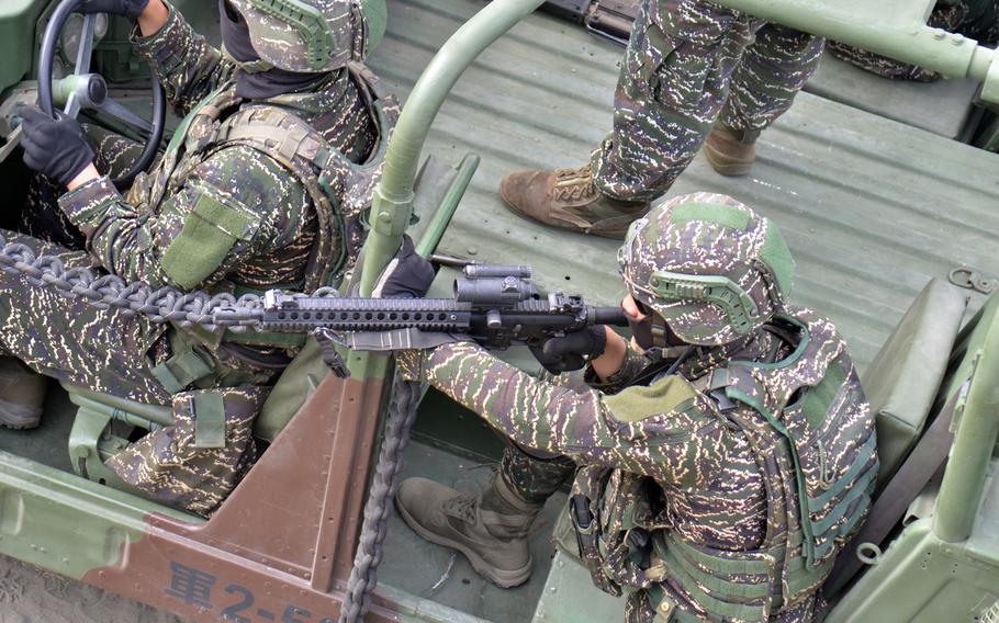 A Taiwanese marine prepares to fire at targets while training near Kaohsiung, Taiwan, Jan. 12, 2023.