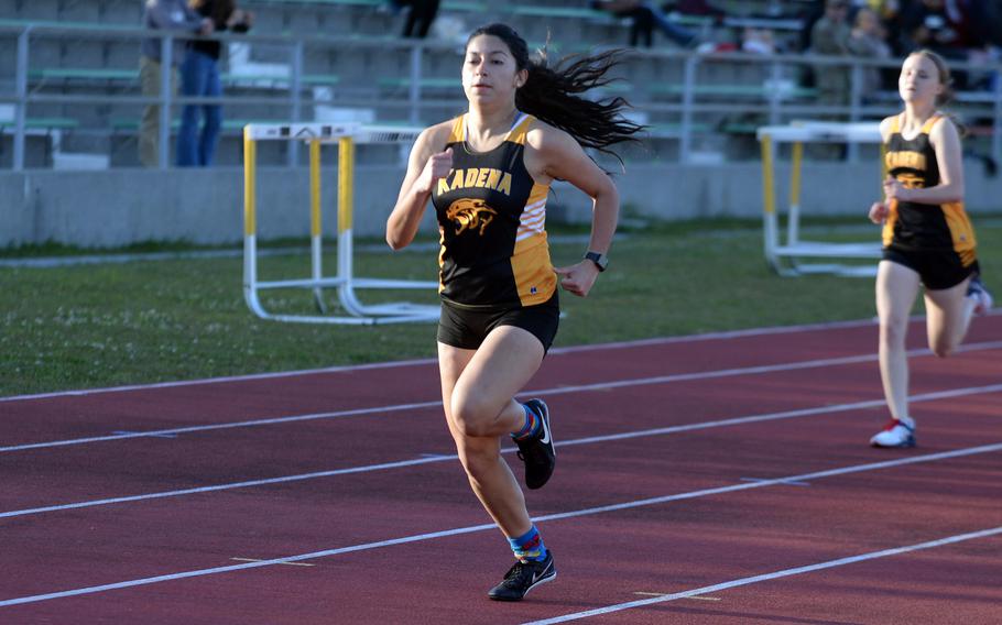 Kadena's Mia Bella Gonzalez heads for the finish of the 400 during Thursday's Day 2 of the two-day Okinawa track and field meet. Gonzalez won in 1 minute, 6.27 seconds.