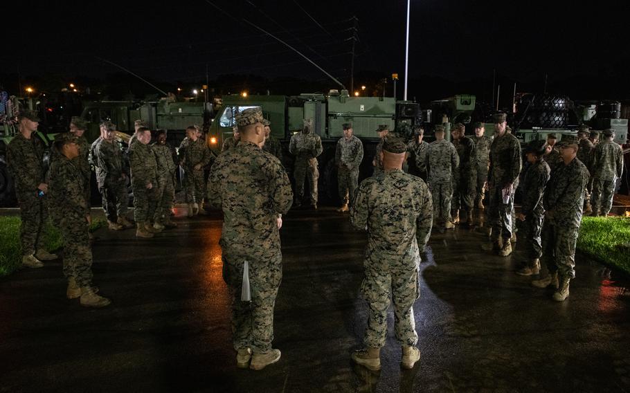 U.S. Marines listen during a pre-convoy brief in Texarkana, Texas May 27, 2021.
