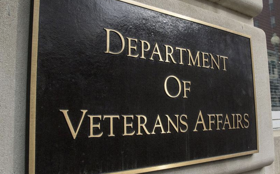 A brown sign with gold lettering outside the Department of Veterans Affairs in Washington.